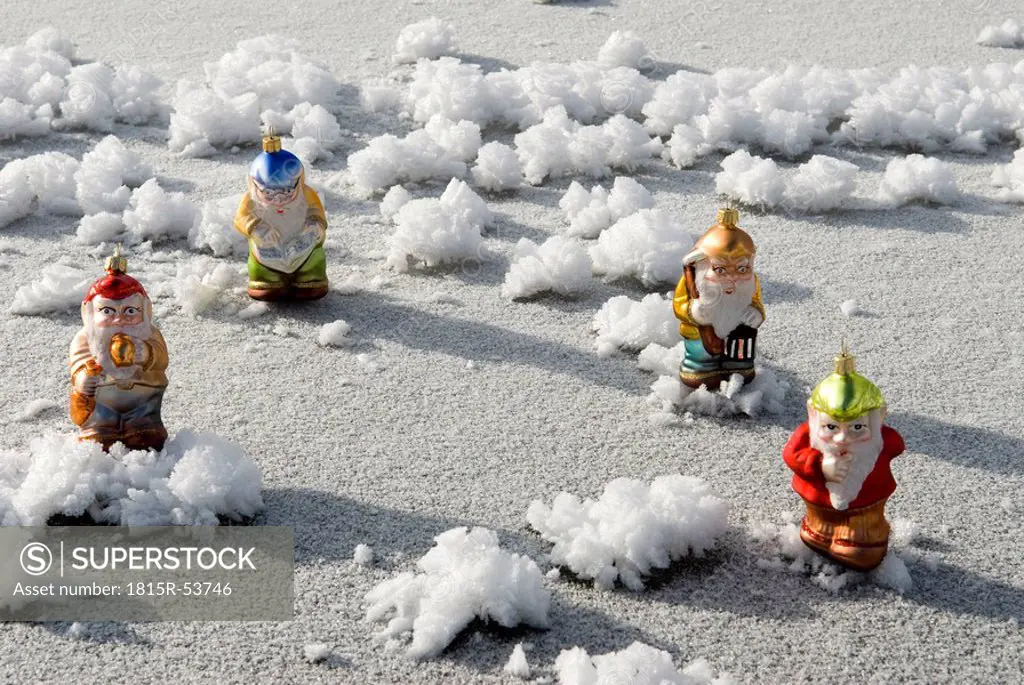 Christmas tree decorations, Garden gnomes standing on frozen lake
