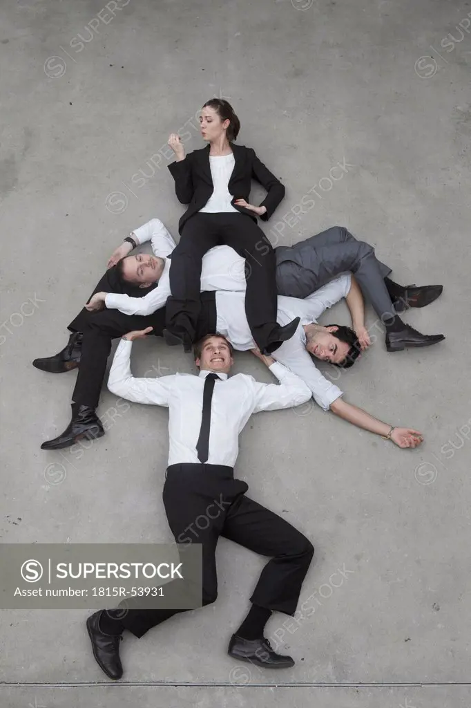 Businessman lifting colleagues, elevated view