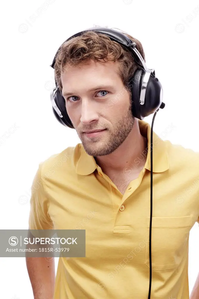 Young man wearing headphones, portrait, close_up