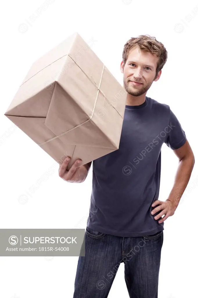 Young man holding packet, portrait