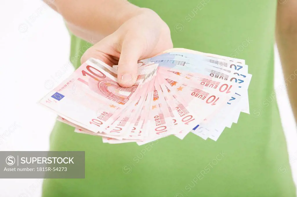 Person holding Euro notes
