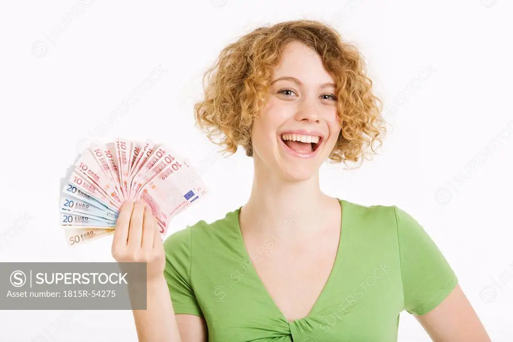 Young woman holding Euro notes, portrait