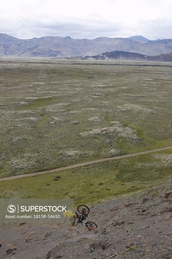 Iceland, Man mountain biking downhill