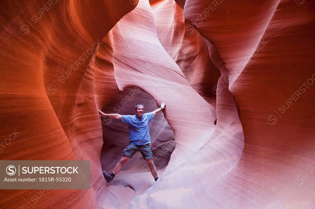 USA, Arizona, Man standing in Lower Antelope Canyon
