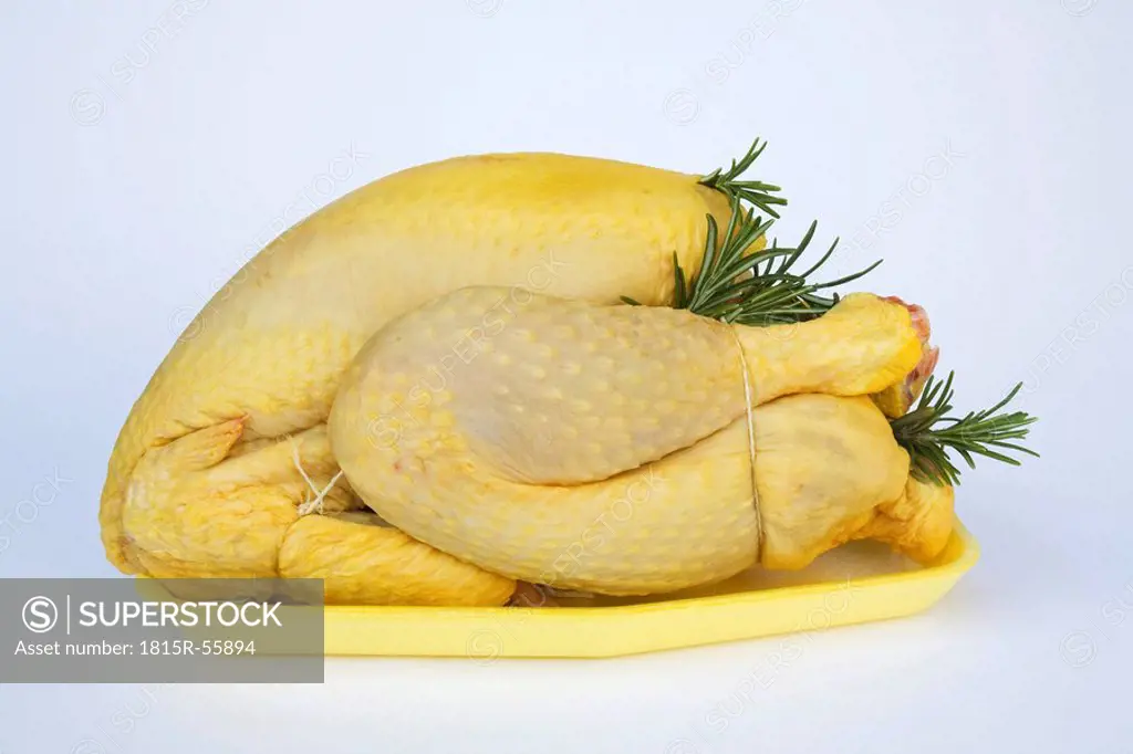 Raw chicken on plastic tray, close_up