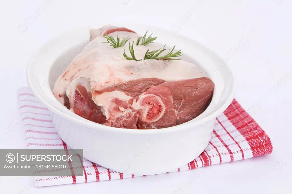 Raw Leg of lamb in roasting tray