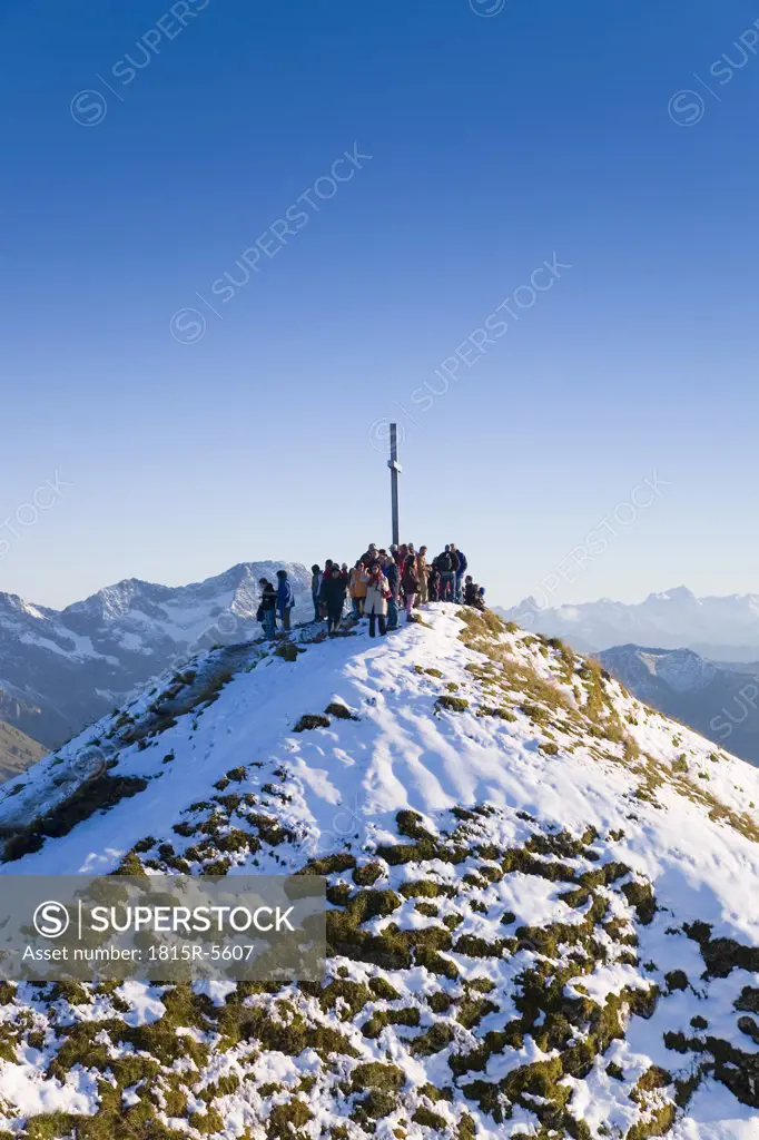 Austria, alps, people on mountain top