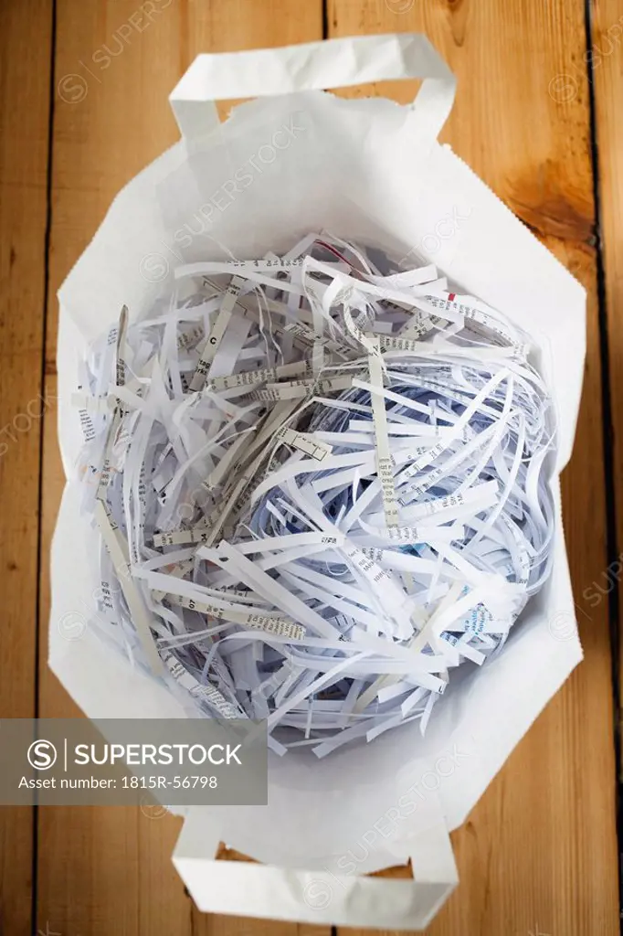 Shredded paper in paper bag