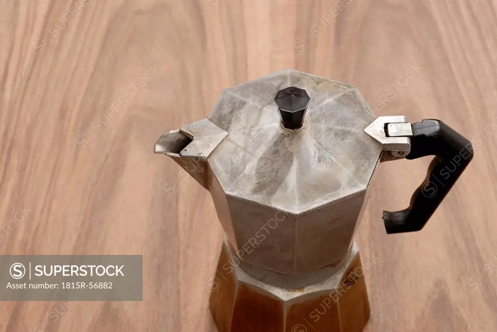 Espresso maker on wooden table, elevated view