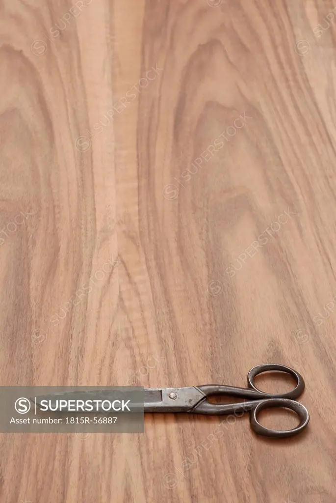 Old Scissors on wooden table, elevated view