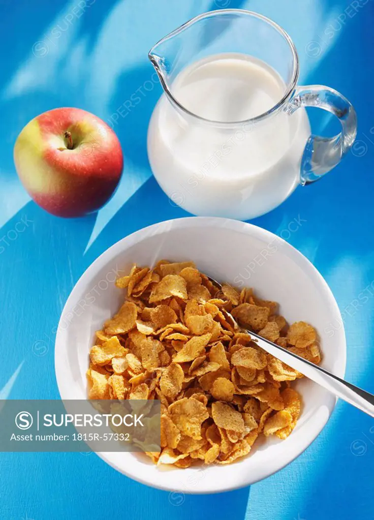 Cornflakes, apple and milk, elevated view