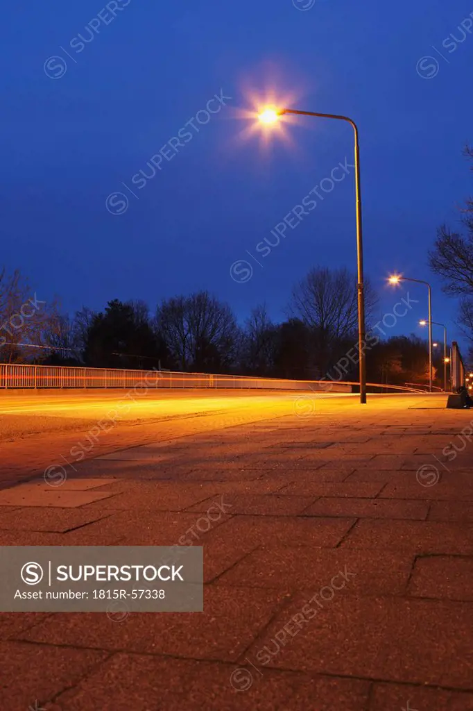 Bridge at night with street lamps