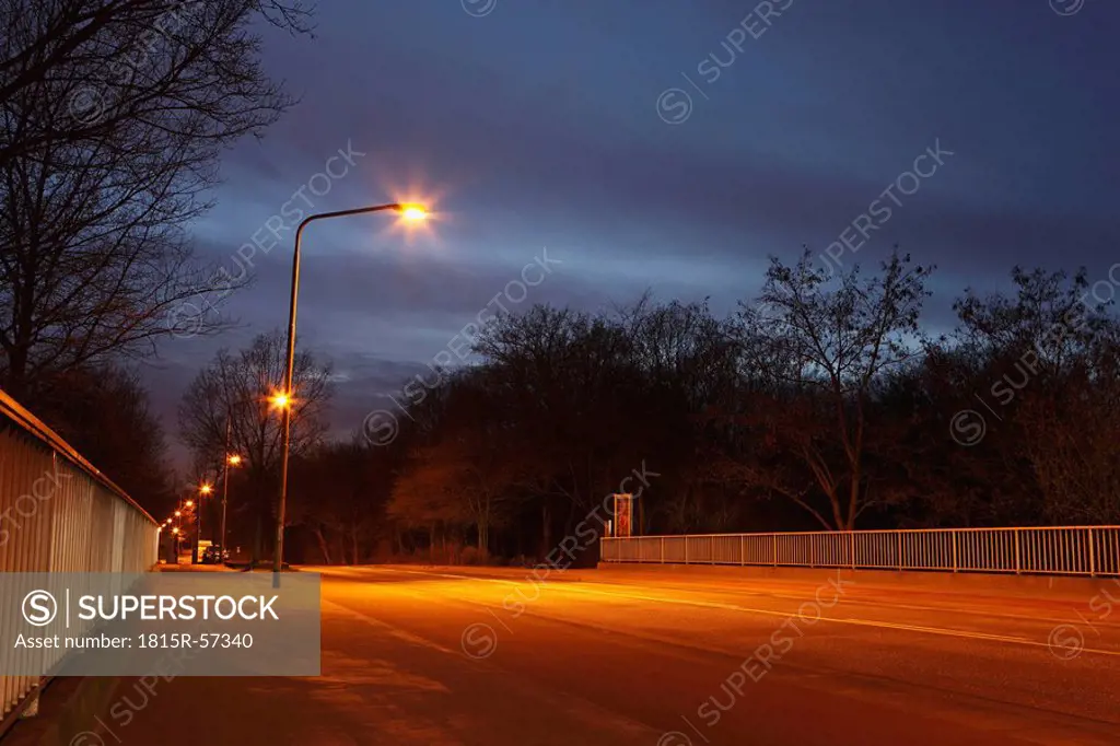 Bridge at night with street lamps