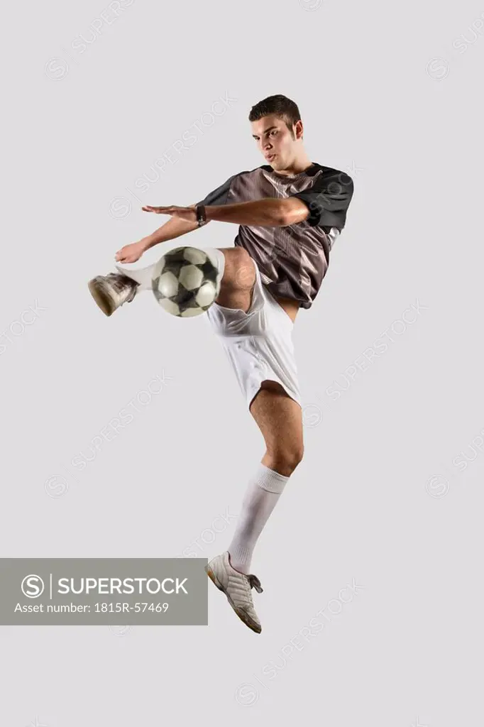 Soccer Player Kicking Ball
