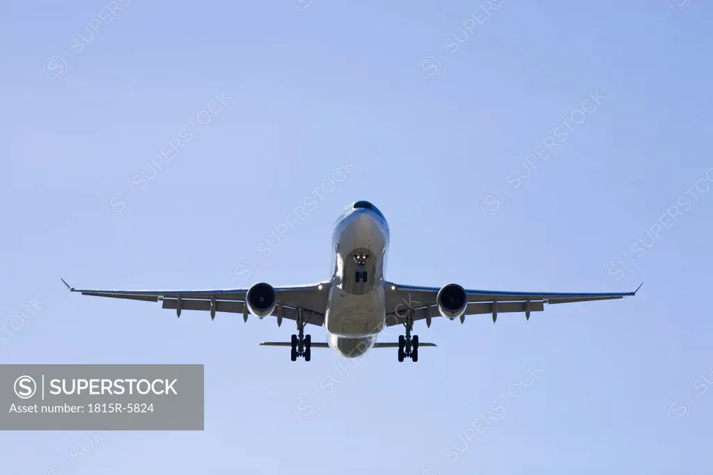 Spain, Andalusia, Malaga, Aeroplane landing, low angle view