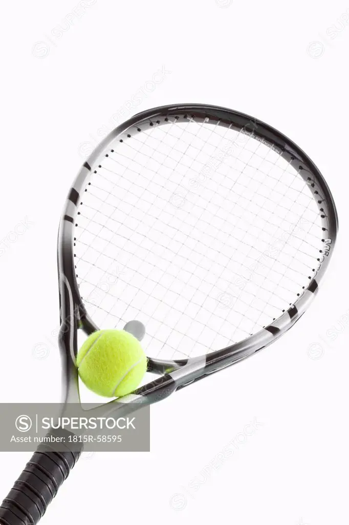Tennis ball on racket, close_up