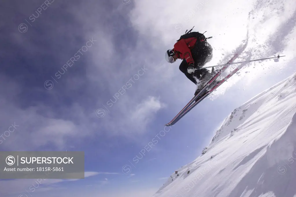 Italy, Gressoney, person jumping ski, low angle view