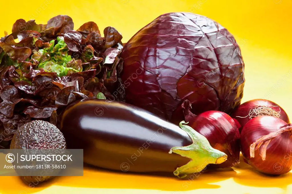 Raw vegetables against yellow background