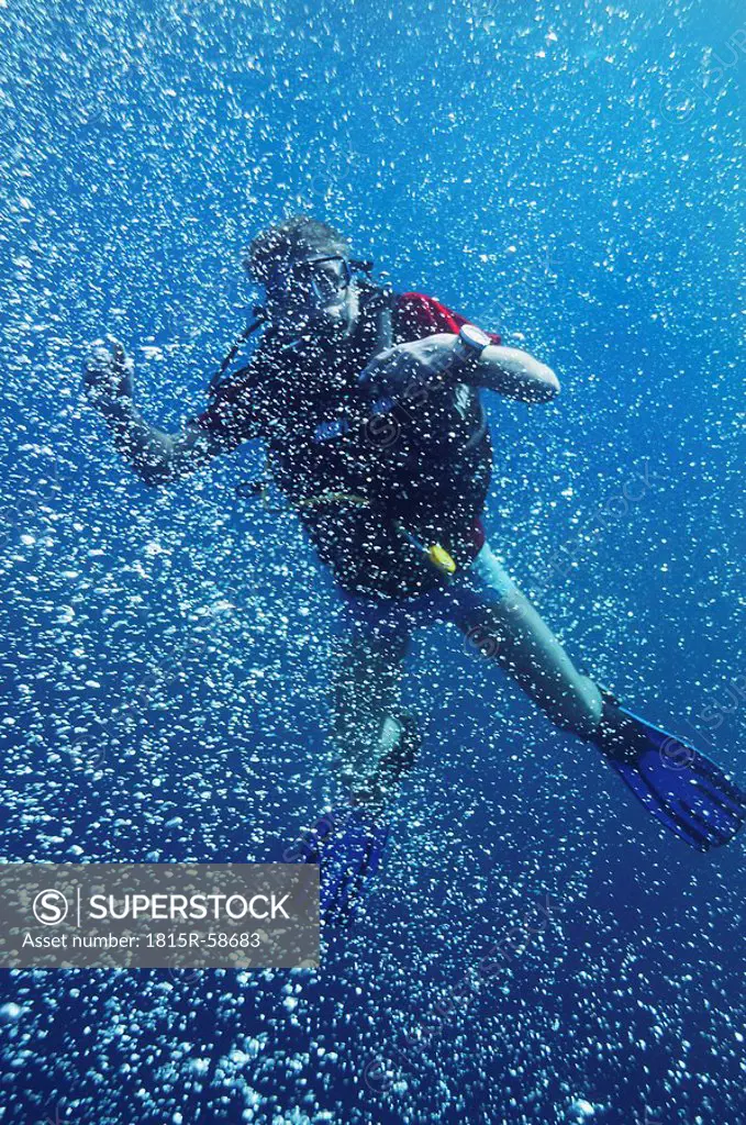 Asia, Indonesia, Bali, Scuba diver, Bubbles in clear blue ocean water