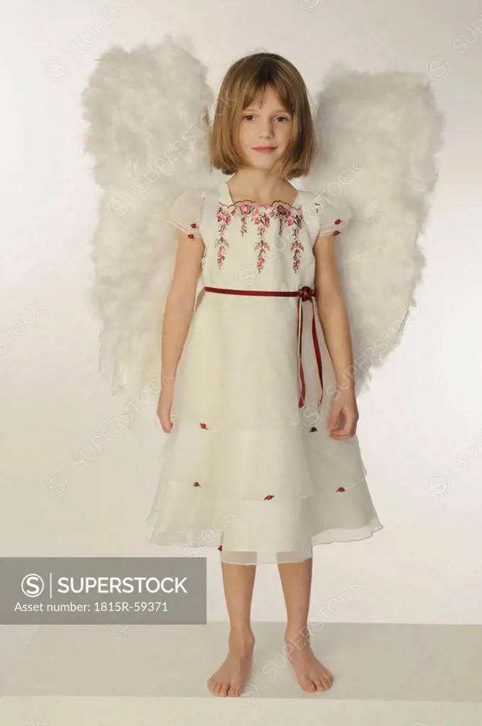 Little girl 6_7 wearing angel wings