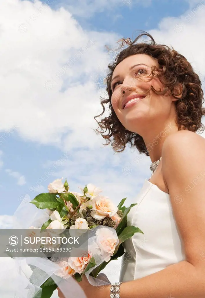 Germany, Bavaria, Smiling Bride with bouquet, outdoors, portrait, close_up