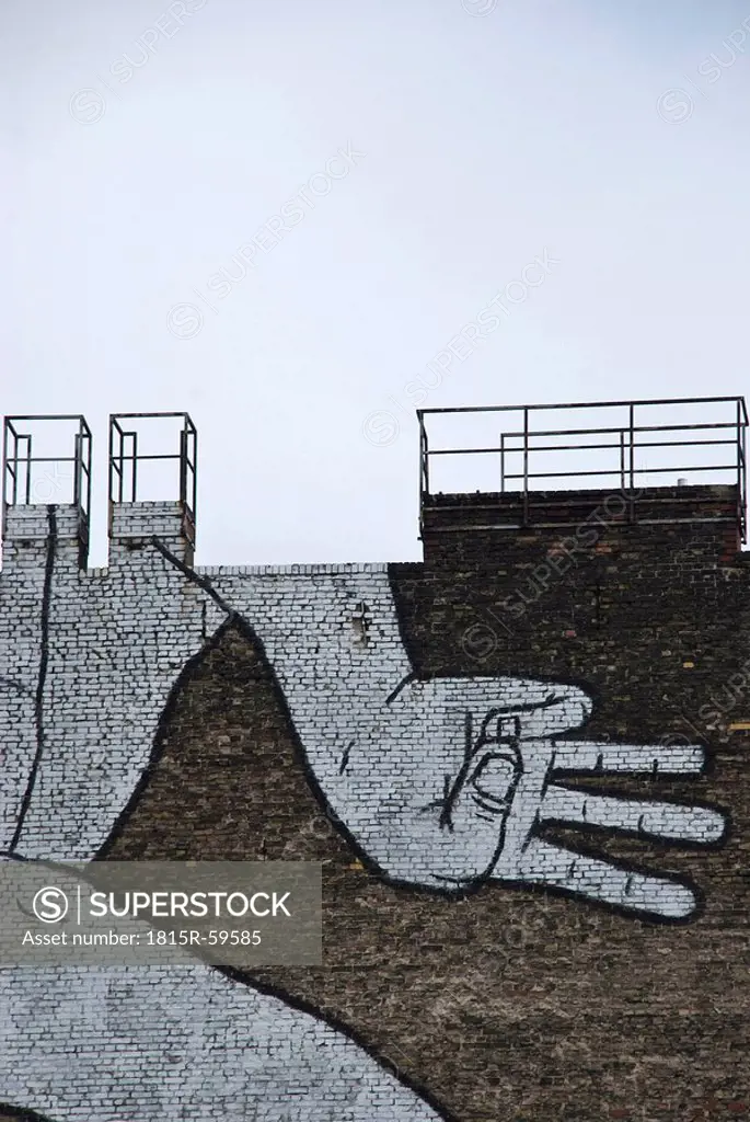 Brick wall with graffiti, hand sign motif