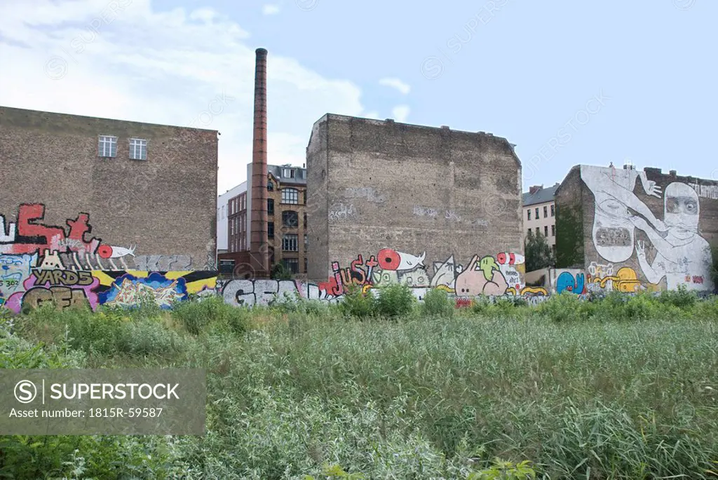 Germany, Berlin, Old factory building with graffiti
