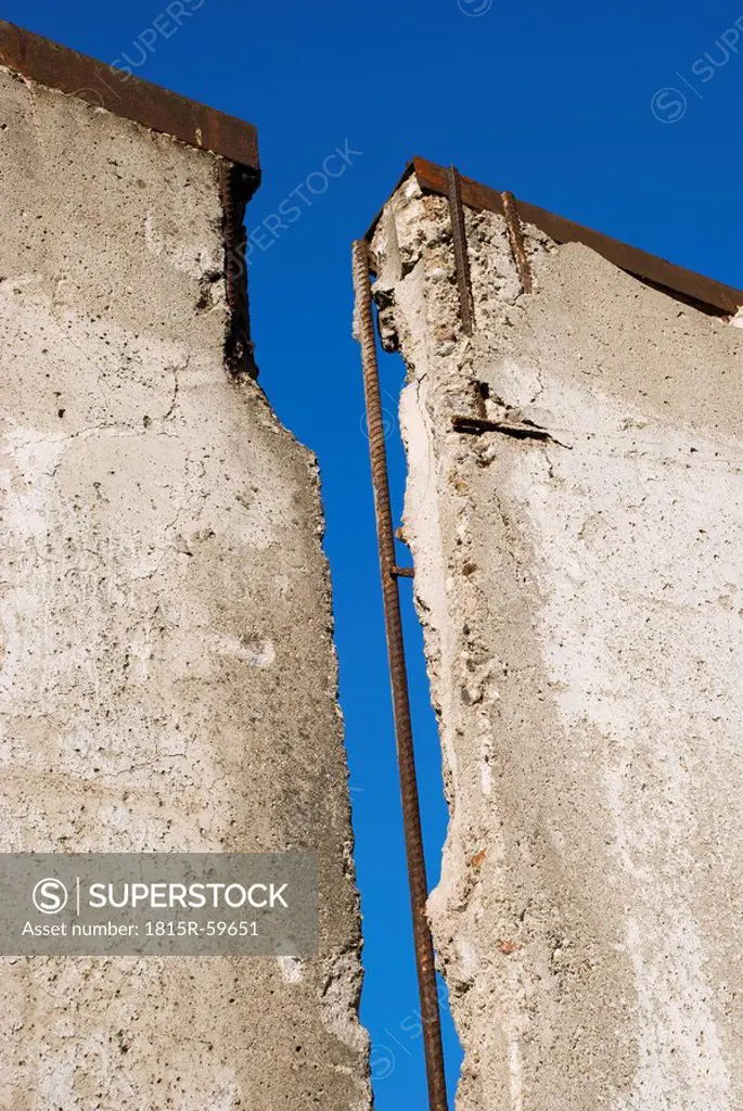 Broken wall against blue sky, close_up