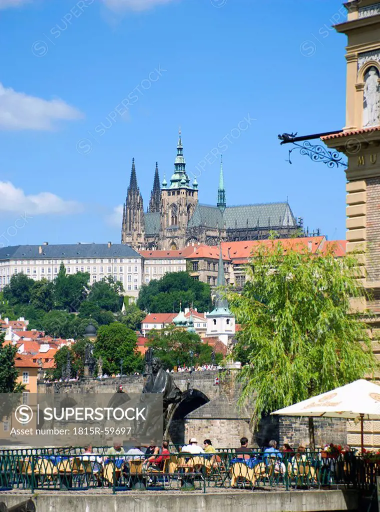 Czech Republic, Prague, Vitava river, restaurant terrace in forefground