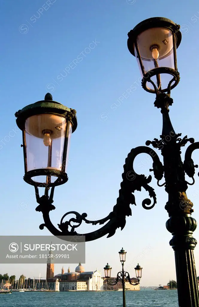 Italy, Venice, Old street lamps, San Giorgio Maggiore in background
