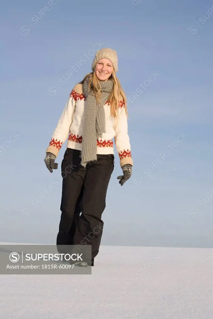 Germany, Bavaria, Munich, Young woman in snowy landscape