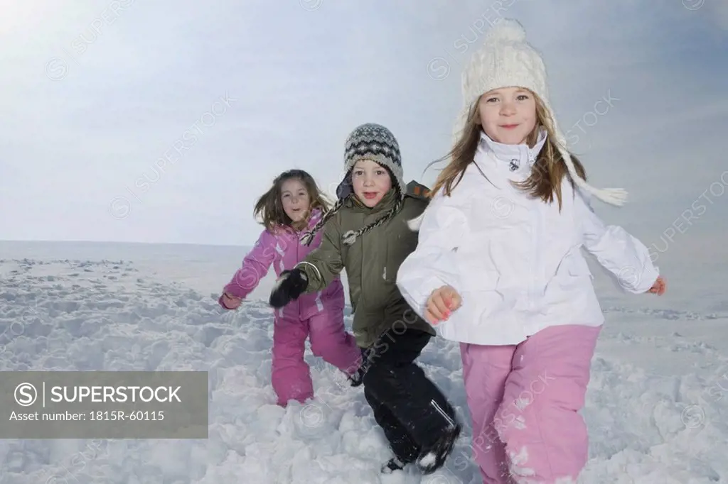 Germany, Bavaria, Munich, Children in snowy landscape