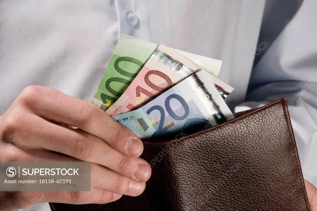Person counting Euro notes, close_up