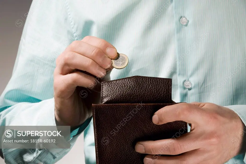 Person holding a wallet, close_up