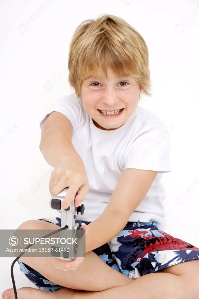 Boy 10_11 playing video game, portrait, close_up