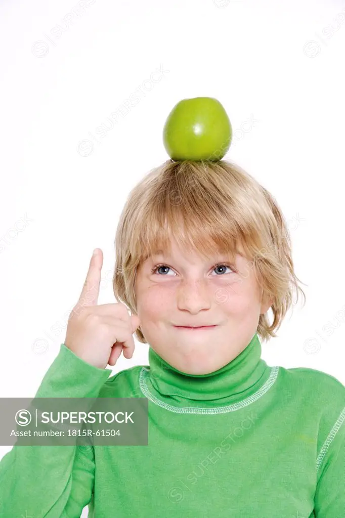 Little boy 10_11 balancing apple on head