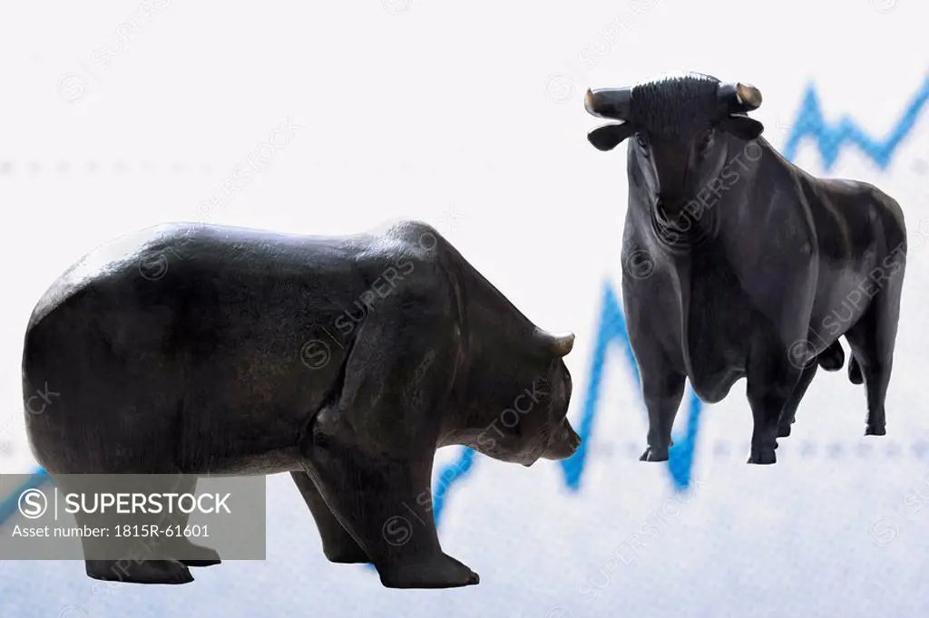 Bull and bear figurines in front of graph, close_up