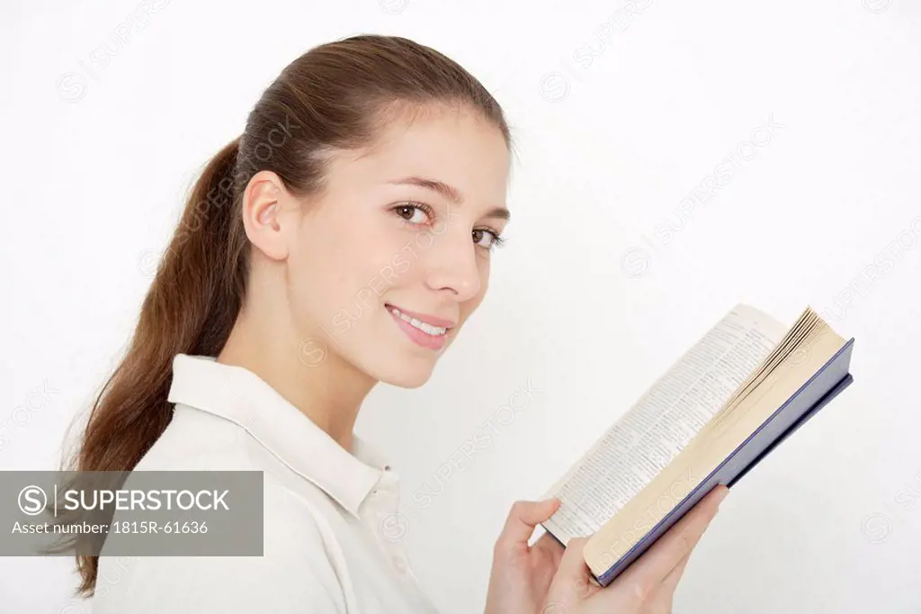Young woman 16_17 holding book