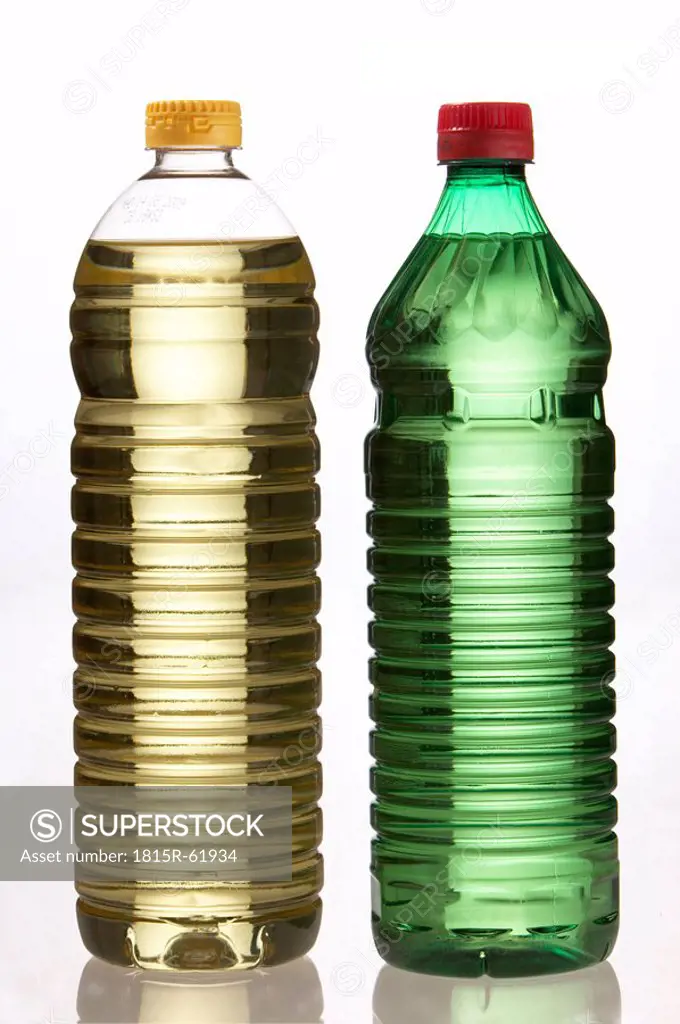 Vinegar and oil in plastic bottles, close_up