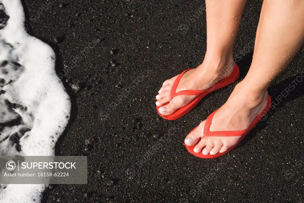 Spain, Lanzarote, Feet on lava sand, elevated view