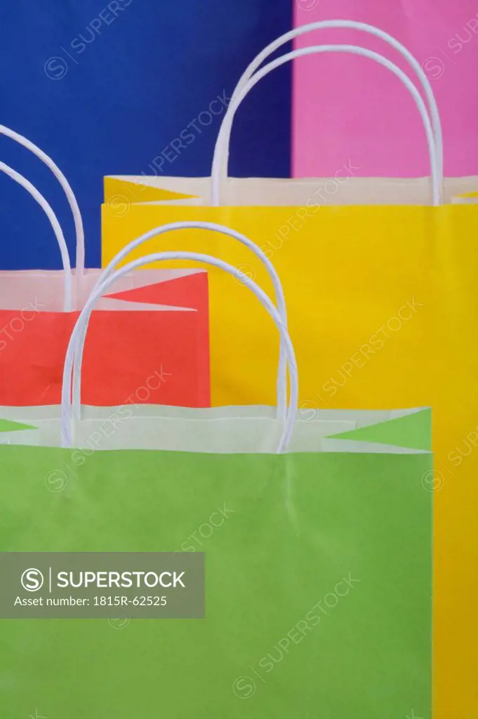 Multicoloured paper shopping bags, full frame, close_up