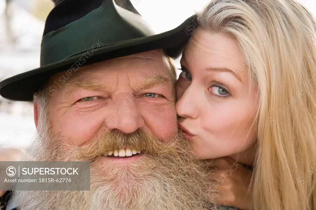 Germany, Bavaria, Upper Bavaria, Senior man and young woman, smiling, portrait, close_up