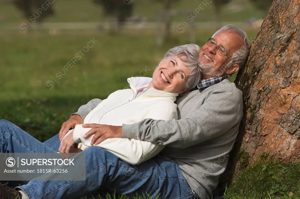 Austria, Karwendel, Senior couple in the countryside, embracing