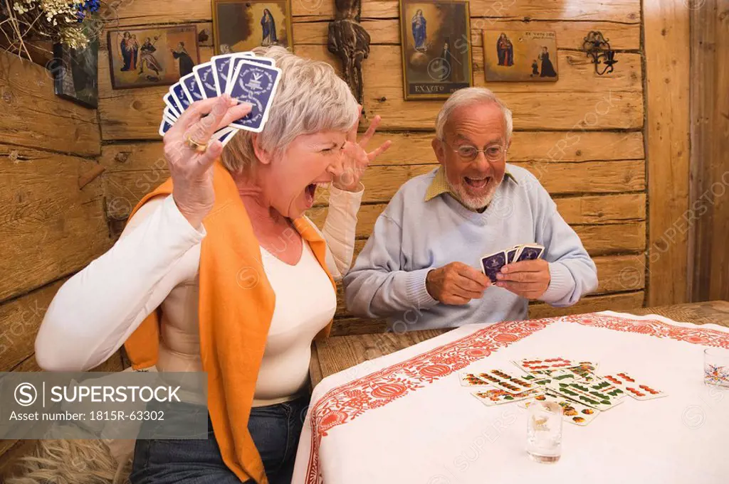 Senior couple playing cards