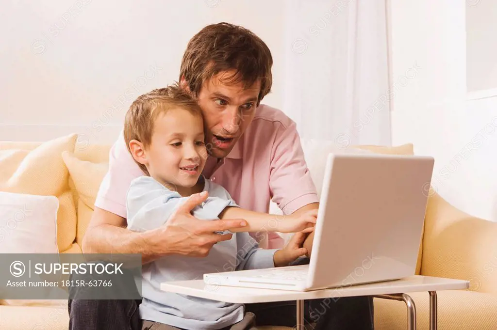 Father and son 4_5 using laptop