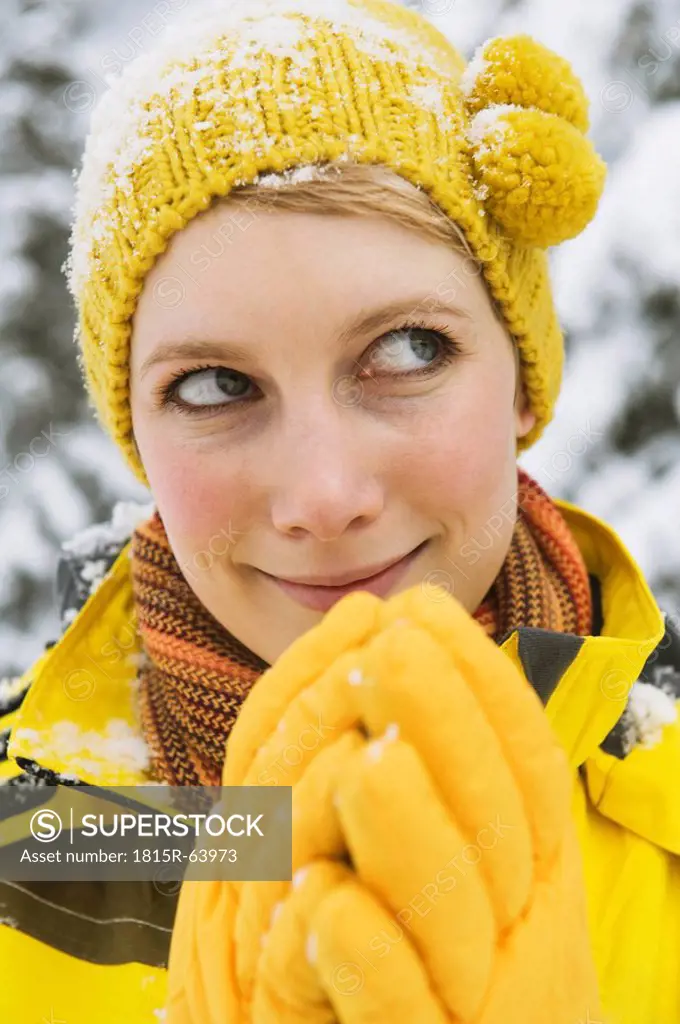 Italy, South Tyrol, Young woman with bobble cap, close up, portrait