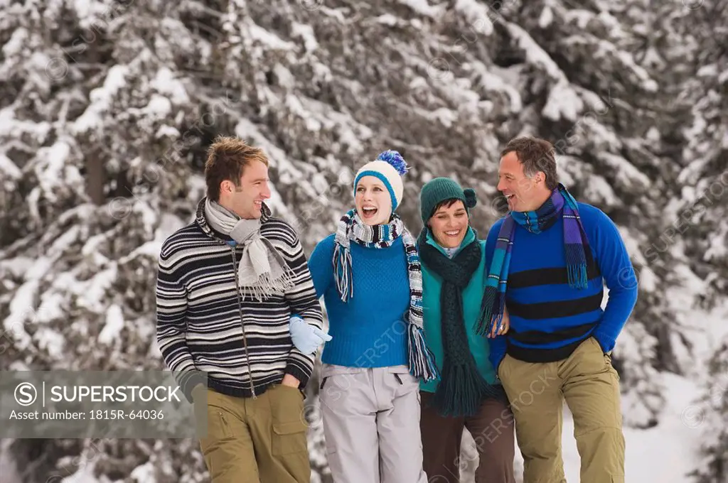 Italy, South Tyrol, Young people taking a winter walk