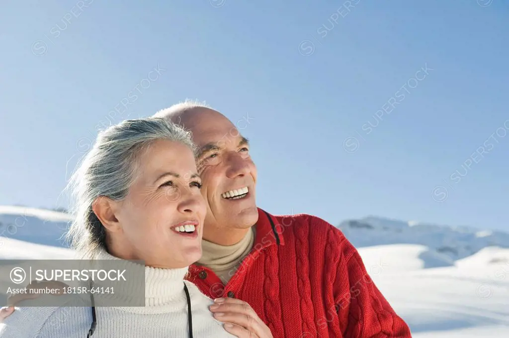 Italy, South Tyrol, Seiseralm, Senior couple in winterly landscape, portrait, close_up