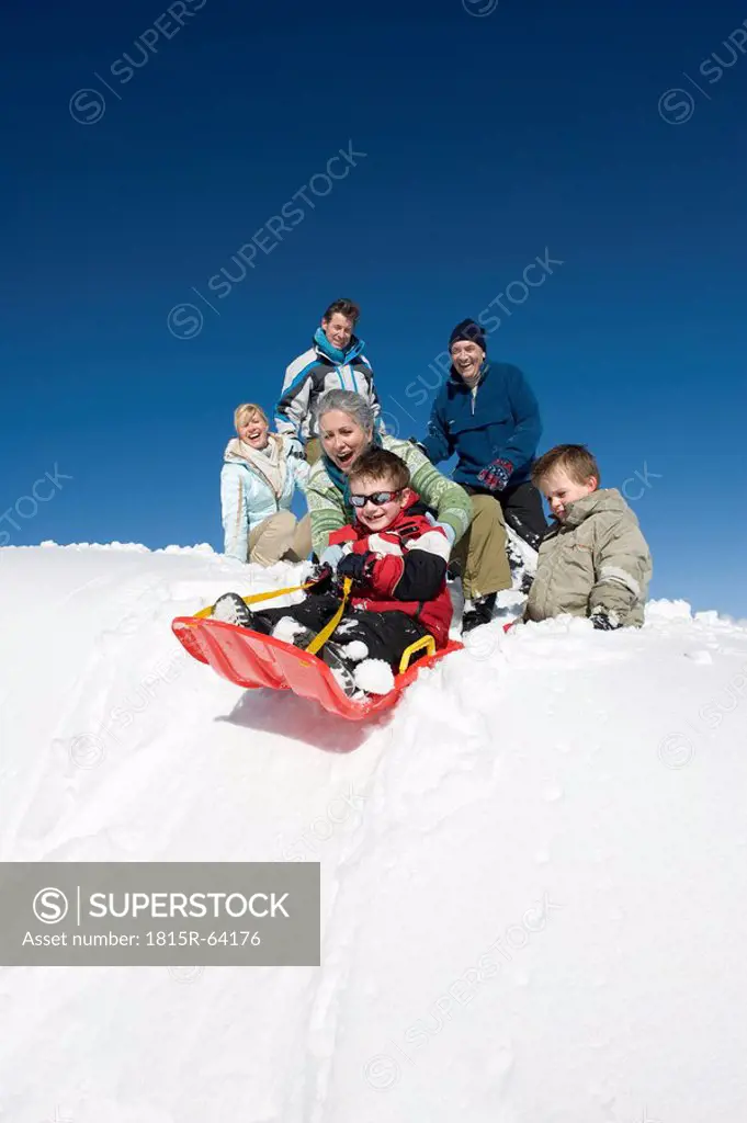 Italy, South Tyrol, Seiseralm, Family sledding