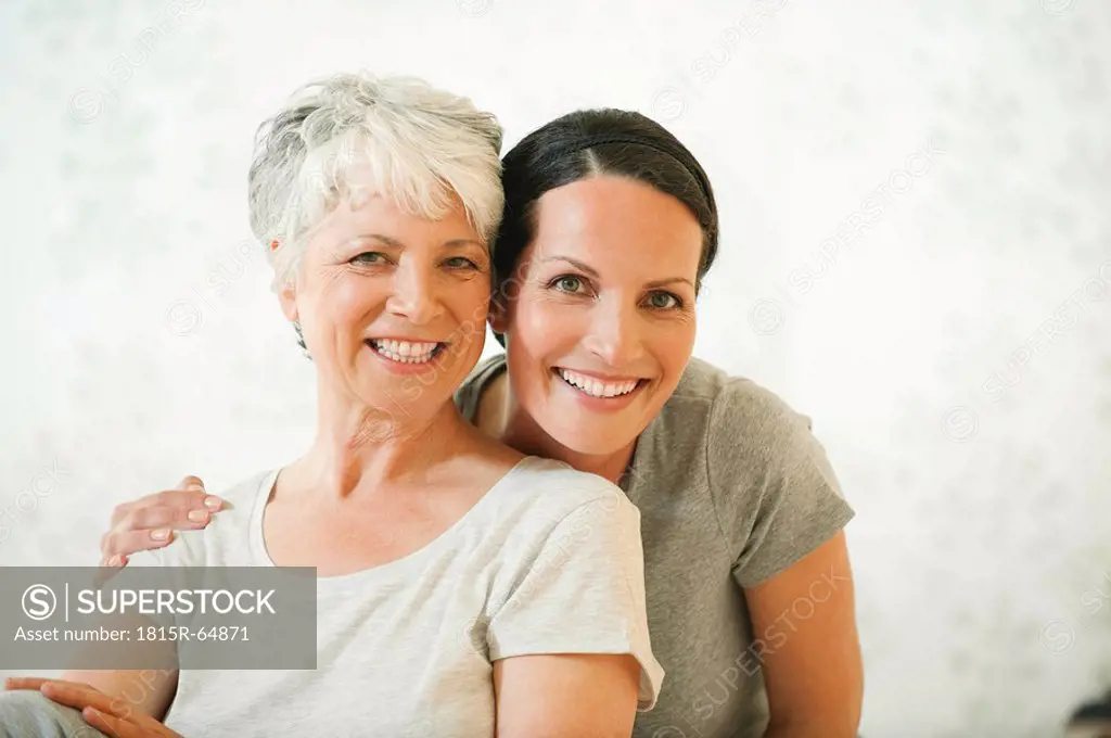 Two women smiling, portrait